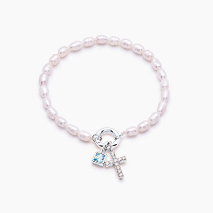 pearl-birthstone-cross-charm-bracelet — Silver / Dec-Blue Topaz